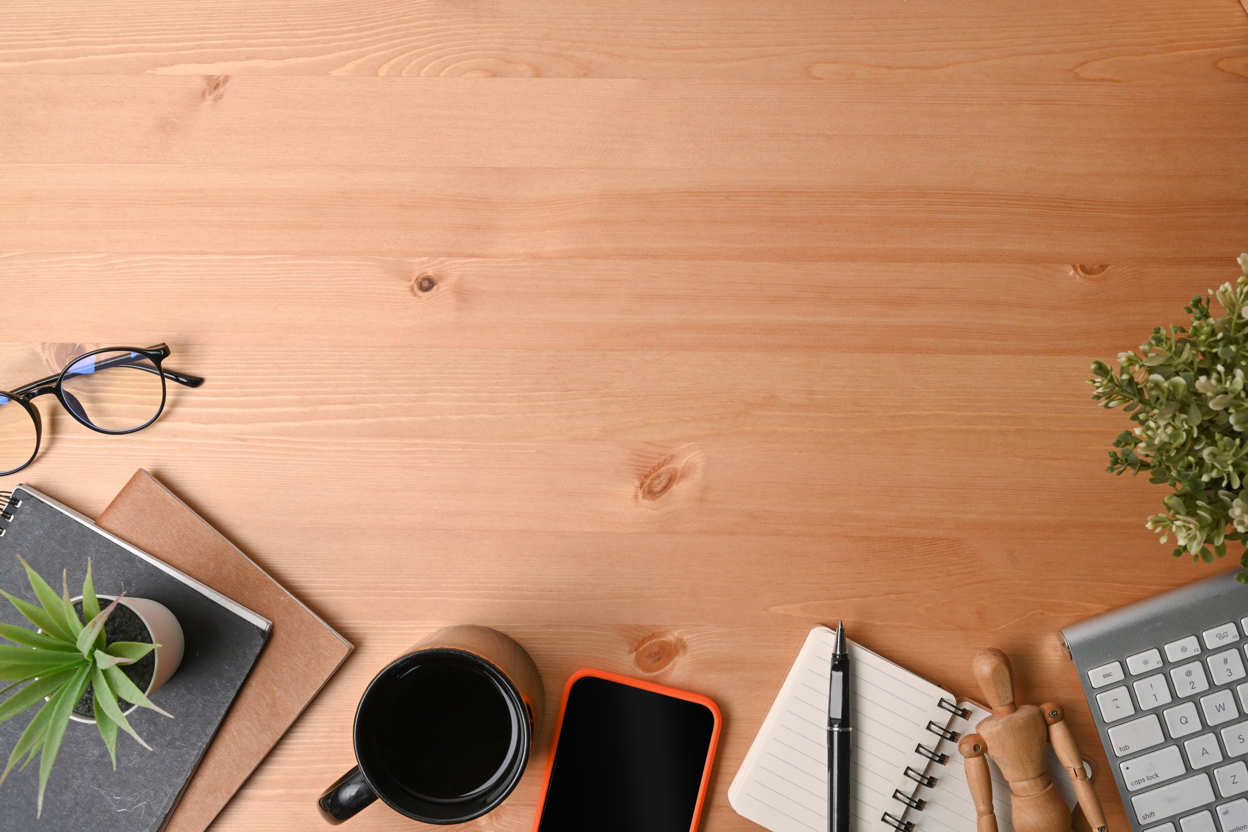 High Angle View of Smart Phone, Notebook, Glasses and Coffee Cup